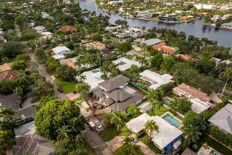 an aerial view of residential houses with city view