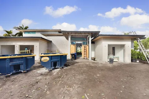 a view of a house with roof and sitting area