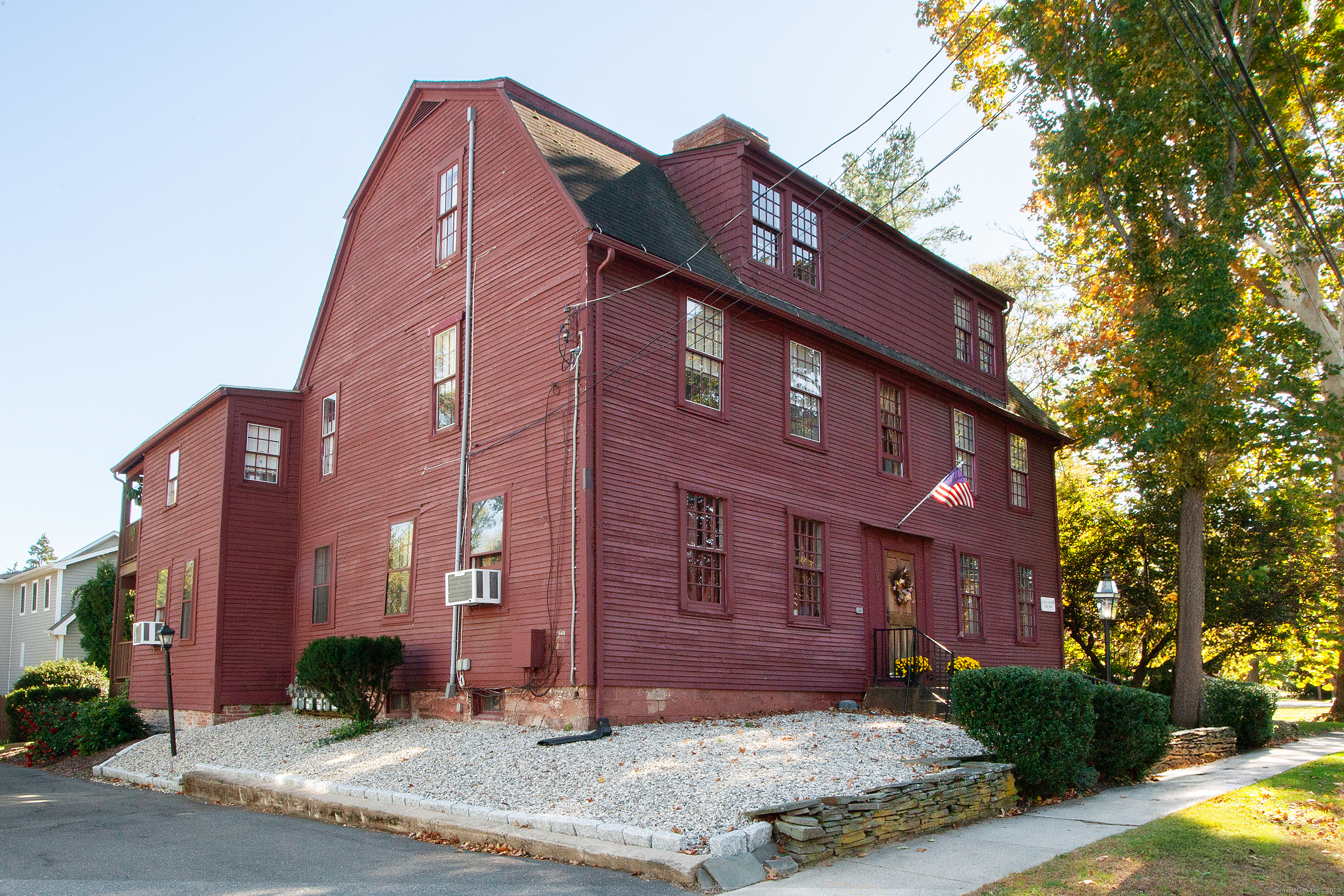 a view of a brick building next to a yard
