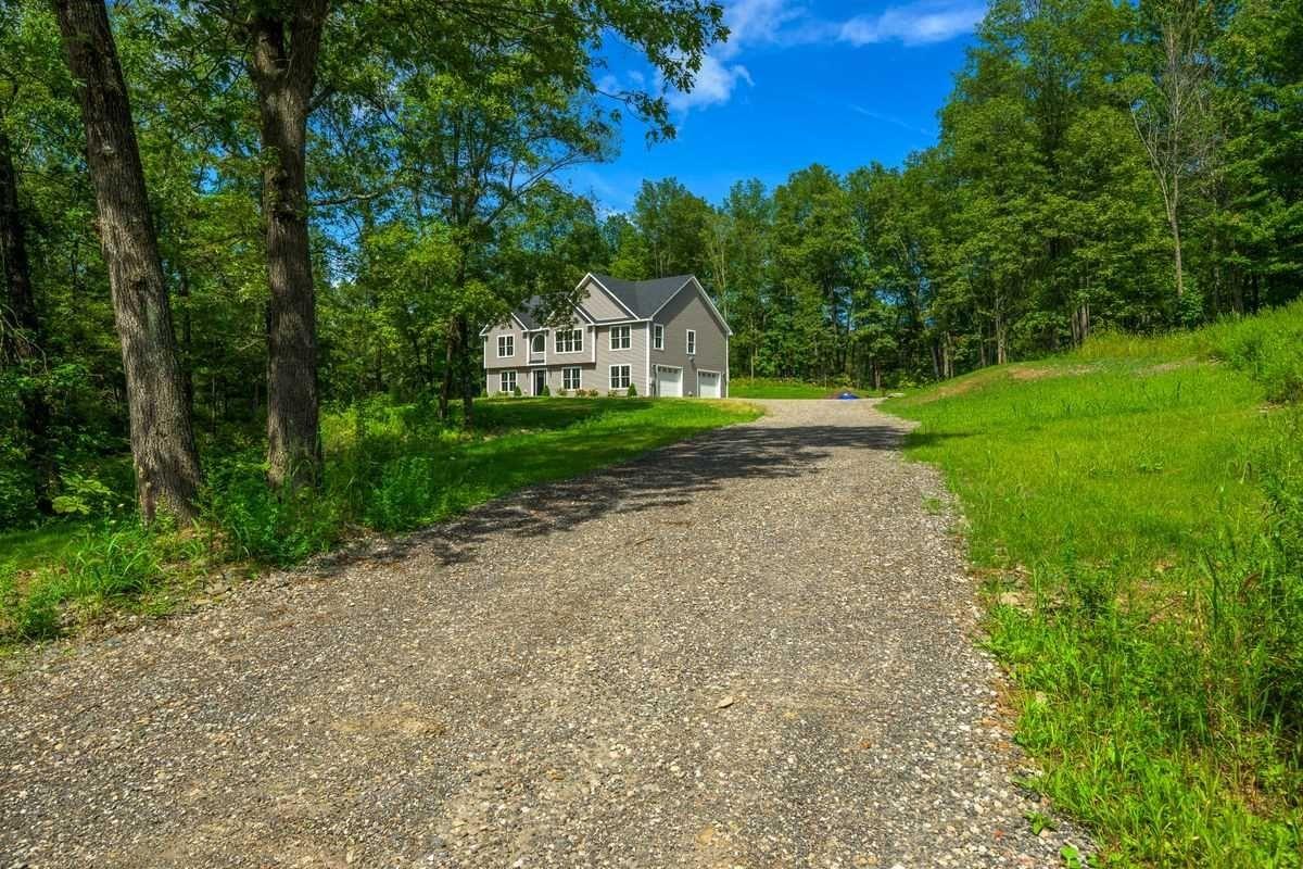 25 Maple Hill Ridge Red Hook, NY 12571 - Photo 1 of 1 a front view of a house with yard and green space