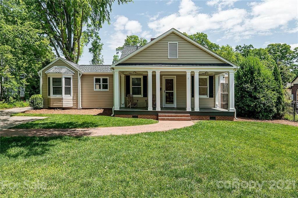 327 Marsh Road Charlotte, NC 28209 - Photo 1 of 48 a front view of a house with a yard
