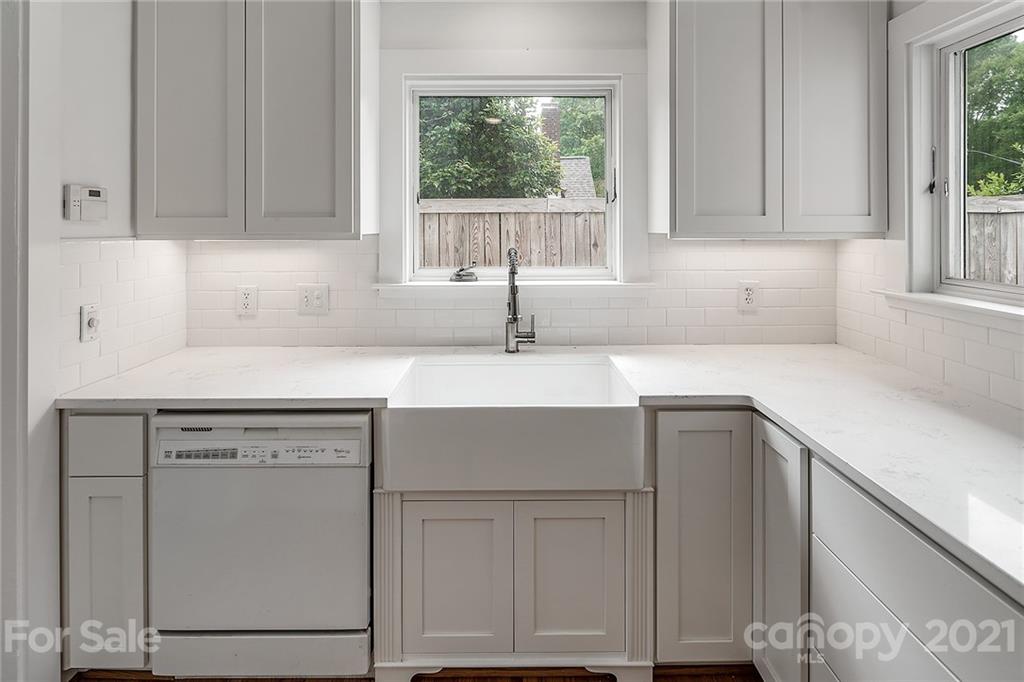 327 Marsh Road Charlotte, NC 28209 - Photo 11 of 48 a kitchen with cabinets appliances and a window