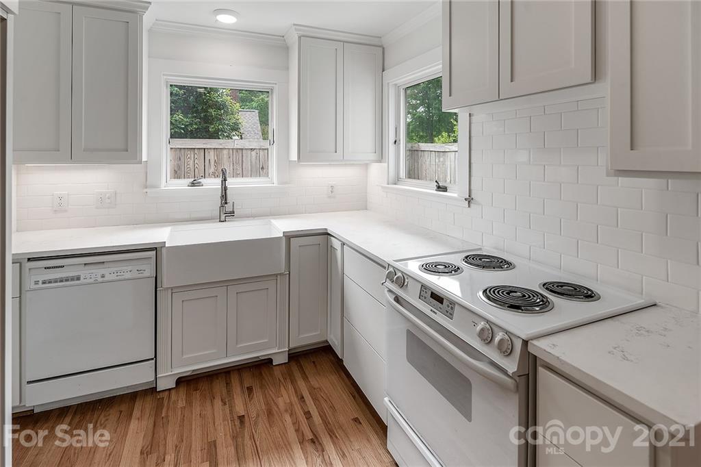 327 Marsh Road Charlotte, NC 28209 - Photo 13 of 48 a kitchen with cabinets and window