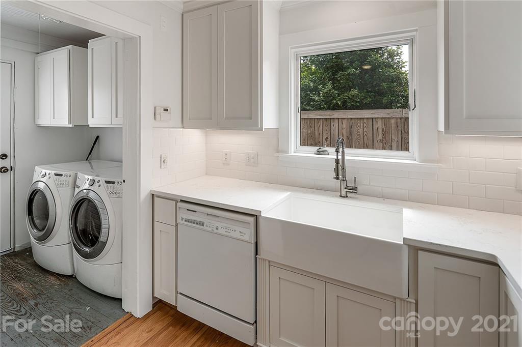 327 Marsh Road Charlotte, NC 28209 - Photo 14 of 48 a kitchen with a sink cabinets and a window
