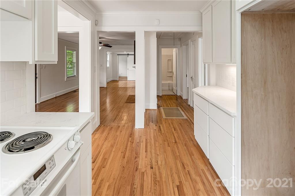 327 Marsh Road Charlotte, NC 28209 - Photo 15 of 48 a bathroom with a sink and a wooden floor