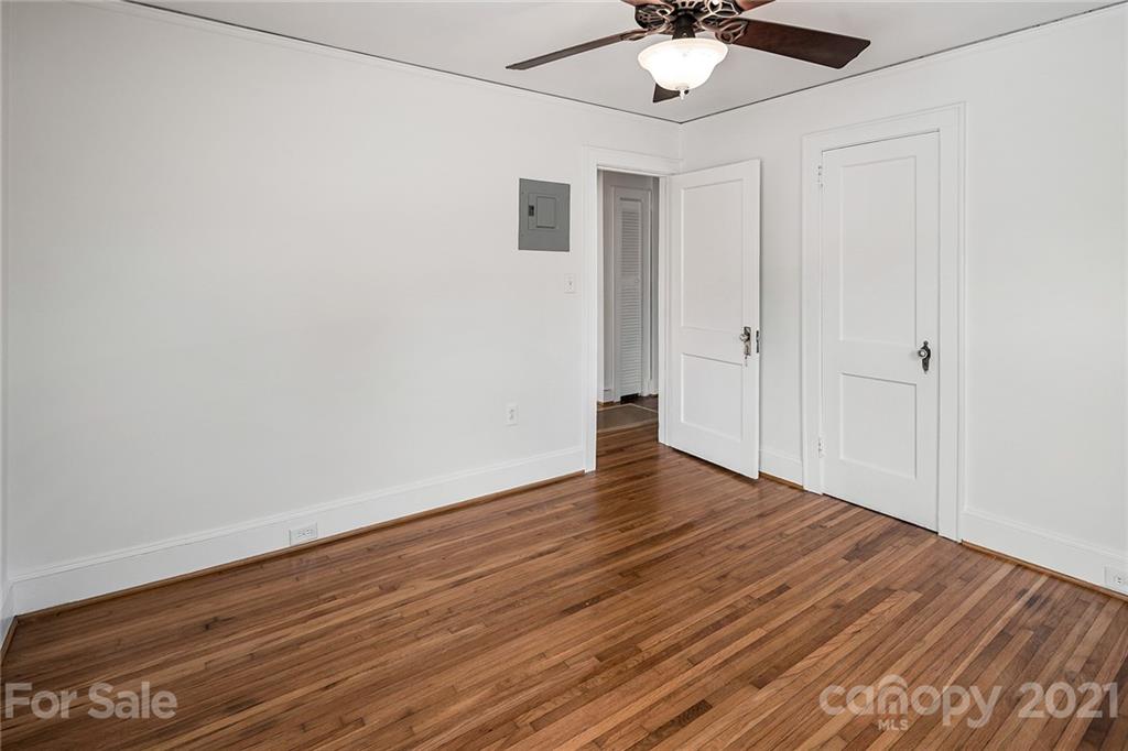 327 Marsh Road Charlotte, NC 28209 - Photo 21 of 48 a view of an empty room with wooden floor