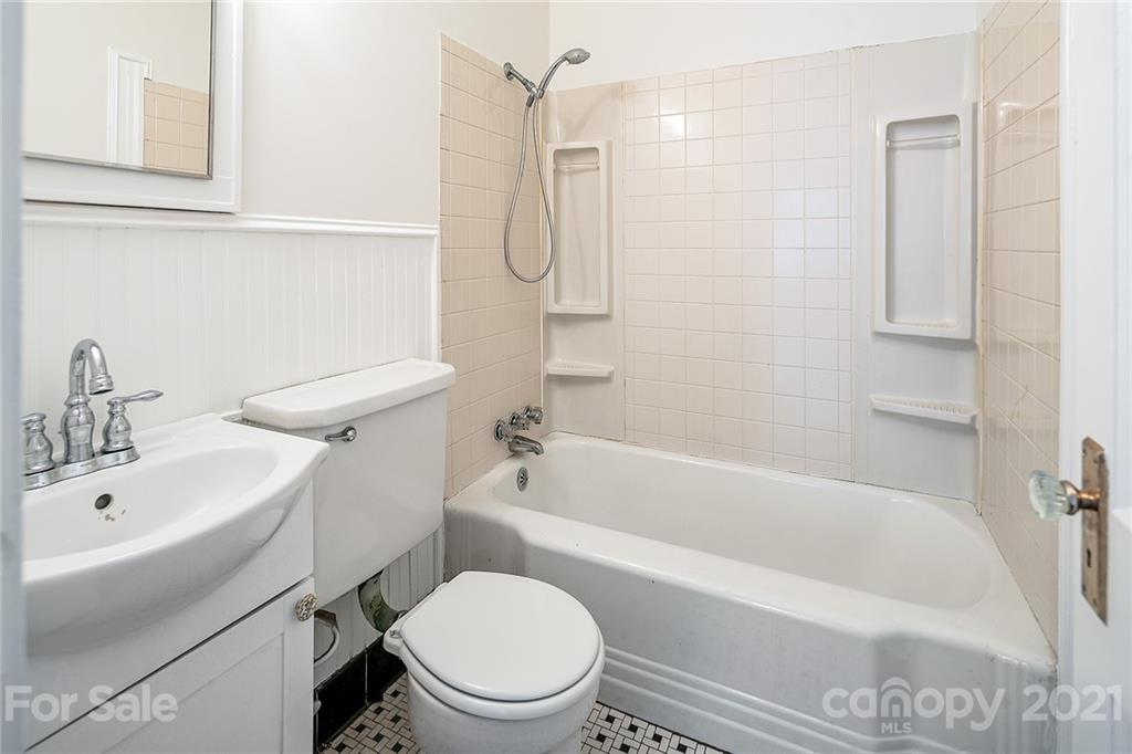 327 Marsh Road Charlotte, NC 28209 - Photo 22 of 48 a bathroom with a toilet sink shower and bathtub
