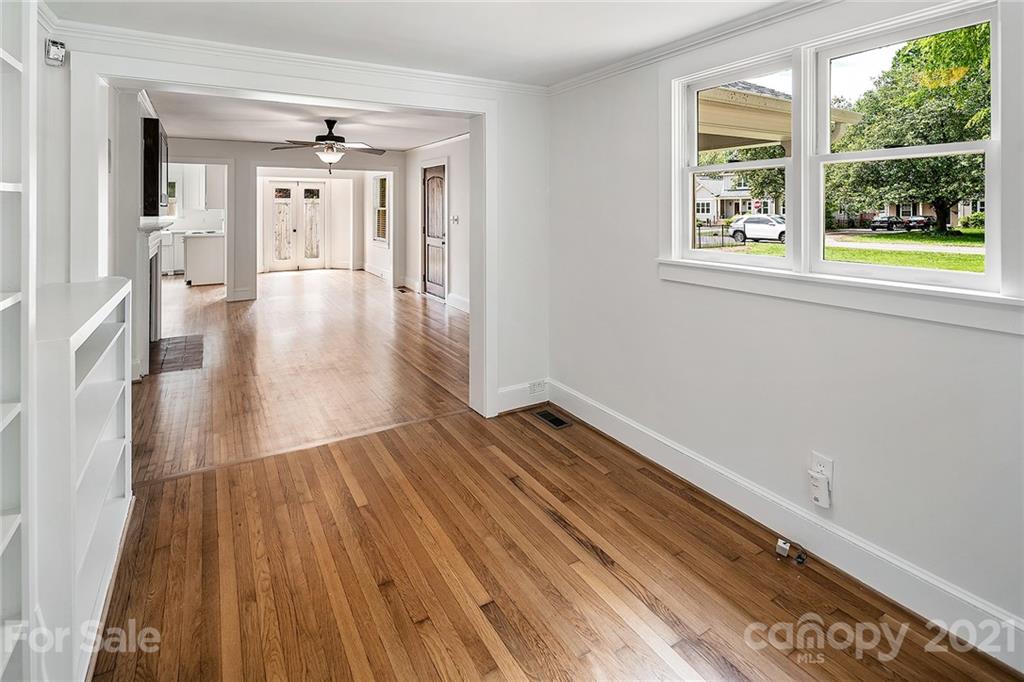 327 Marsh Road Charlotte, NC 28209 - Photo 34 of 48 a view of an empty room with wooden floor and a window