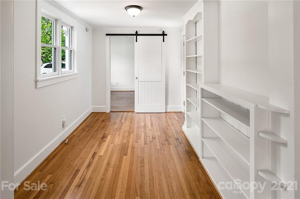 327 Marsh Road Charlotte, NC 28209 - Photo 35 of 48 wooden floor in an empty room with a window