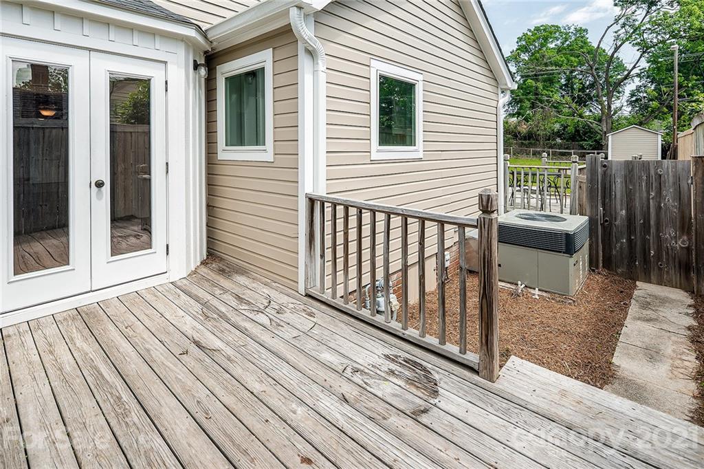 327 Marsh Road Charlotte, NC 28209 - Photo 41 of 48 a view of a wooden deck with a yard