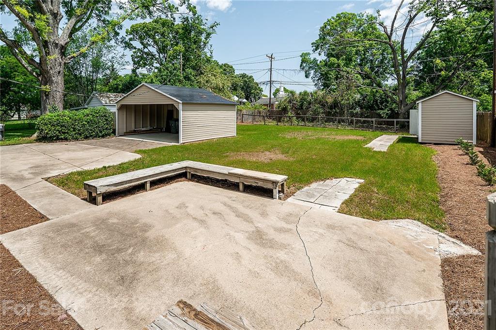 327 Marsh Road Charlotte, NC 28209 - Photo 42 of 48 a view of a backyard with a garden and entertaining space