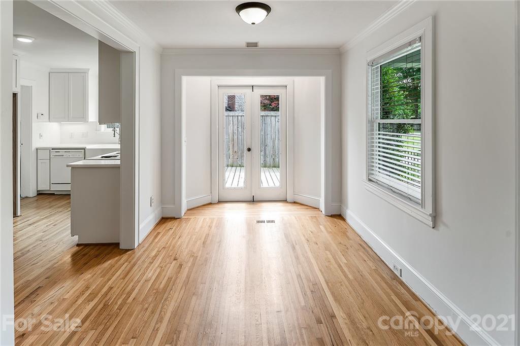 327 Marsh Road Charlotte, NC 28209 - Photo 9 of 48 a view of an empty room with wooden floor and a window