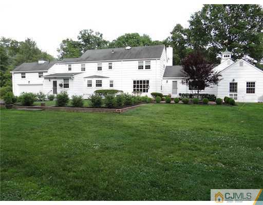 10 Southfield Road Edison, NJ 08820 - Photo 3 of 14 a front view of a house with a yard