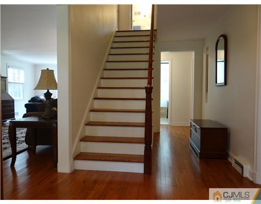 10 Southfield Road Edison, NJ 08820 - Photo 4 of 14 a view of entryway and hall with wooden floor