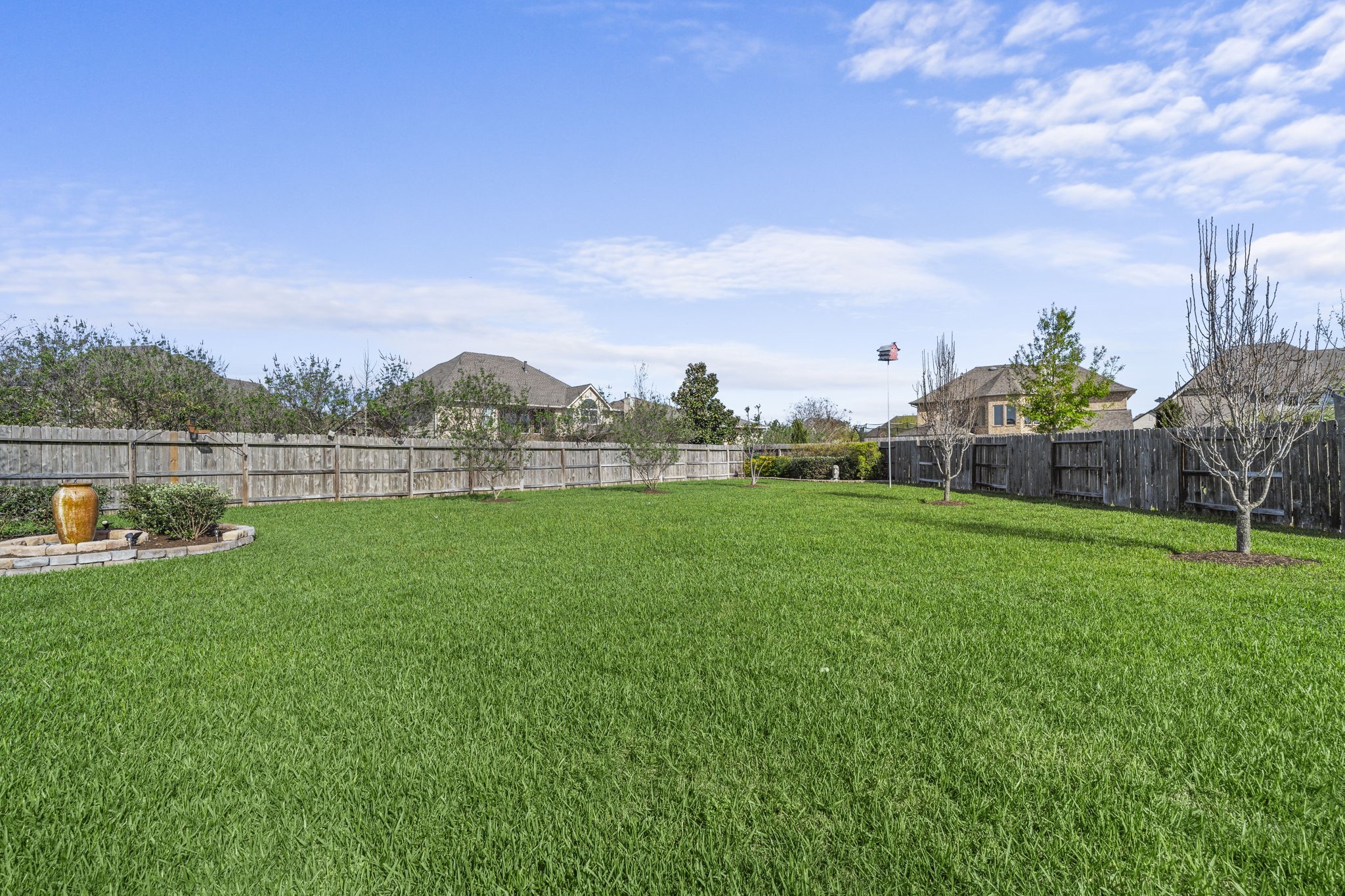 3426 Summer Ranch Drive Katy, TX 77494 - Photo 33 of 48 The expansive backyard offers endless possibilities, with a large grassy area ideal for play, pets, or even a future pool.