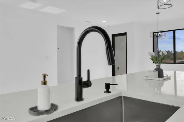 a view of living room with furniture a flat screen tv and a window