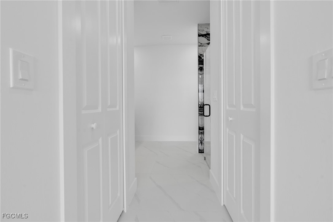 3602 20th Street Southwest Lehigh Acres, FL 33976 - Photo 34 of 40 a bathroom with a shower