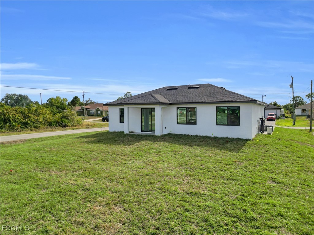 3602 20th Street Southwest Lehigh Acres, FL 33976 - Photo 7 of 40 a view of a house with a yard