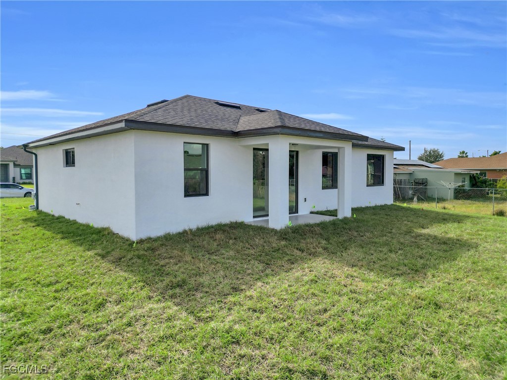 3602 20th Street Southwest Lehigh Acres, FL 33976 - Photo 10 of 40 a view of a house with a yard