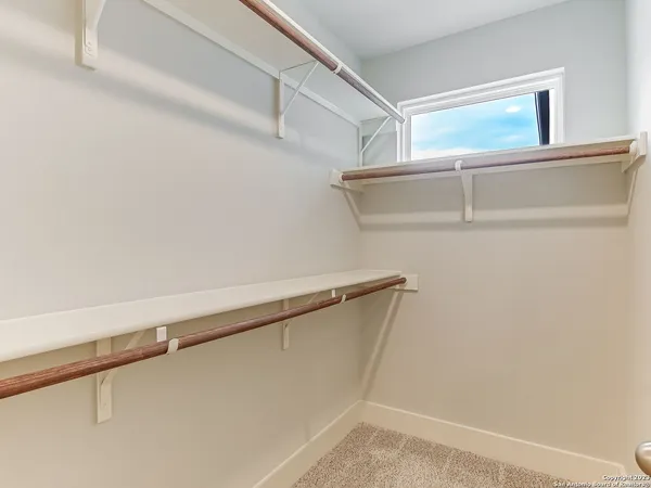 a bathroom with a shower sink and mirror