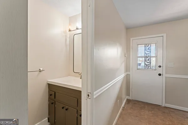 a view of a hallway with front door
