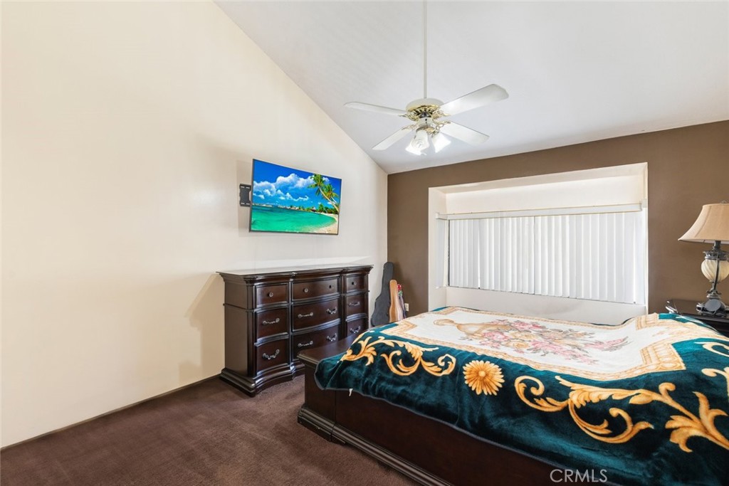 1441 Summit Drive Chula Vista, CA 91910 - Photo 19 of 29 a bedroom with a bed and a chandelier