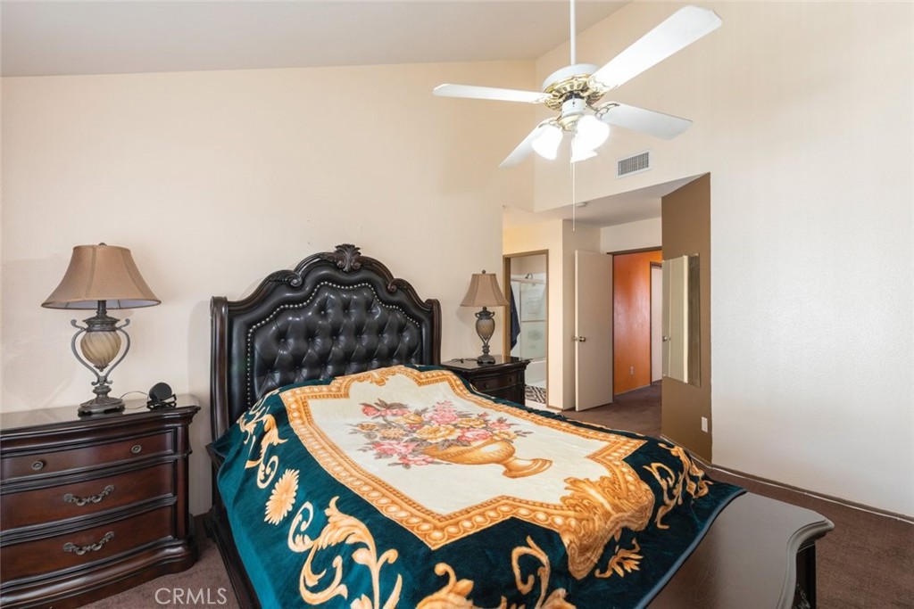 1441 Summit Drive Chula Vista, CA 91910 - Photo 20 of 29 a bedroom with a bed and a chandelier