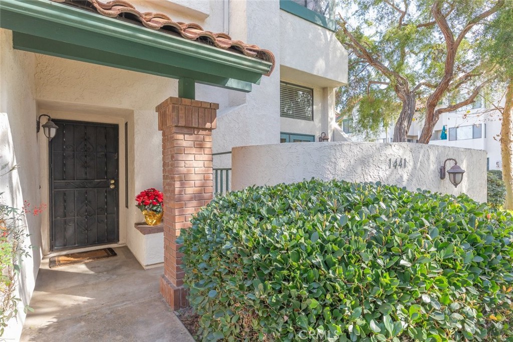 1441 Summit Drive Chula Vista, CA 91910 - Photo 4 of 29 a front view of a house with garden