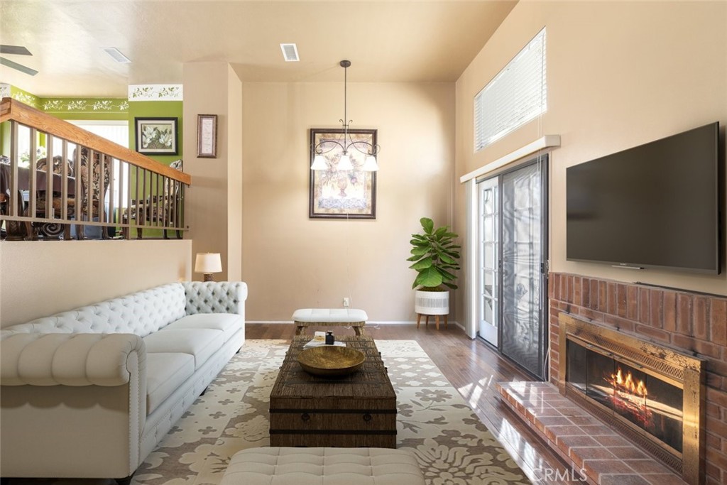 1441 Summit Drive Chula Vista, CA 91910 - Photo 6 of 29 a living room with furniture and a flat screen tv