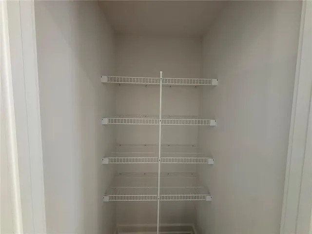 a view of a room with shelves