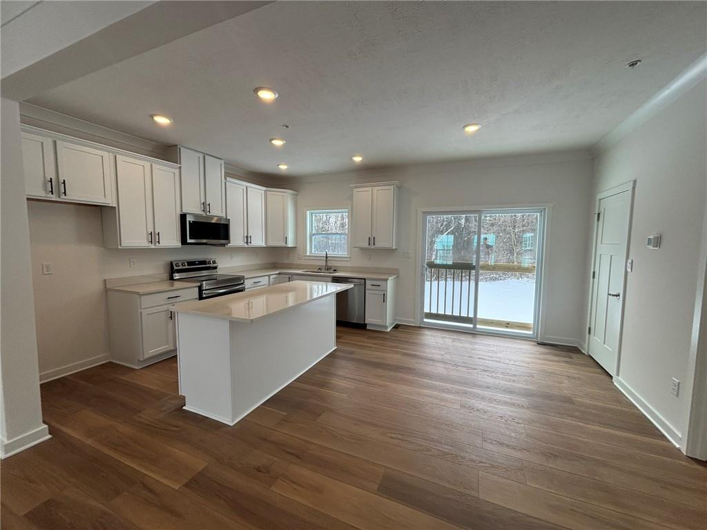 176 Lockheed Drive Coraopolis, PA 15108 - Photo 9 of 21 a kitchen with stainless steel appliances granite countertop a stove a sink and a refrigerator