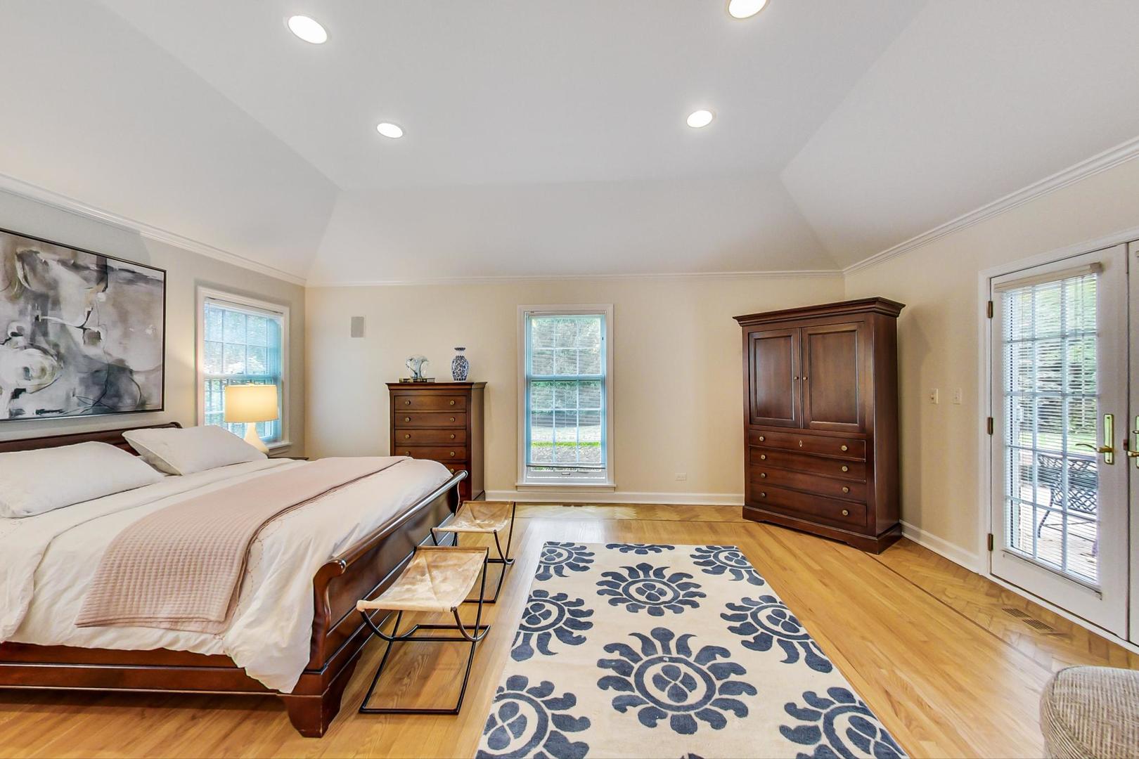 180 Westview Road Winnetka, IL 60093 - Photo 16 of 31 a bedroom with a bed and wooden floor