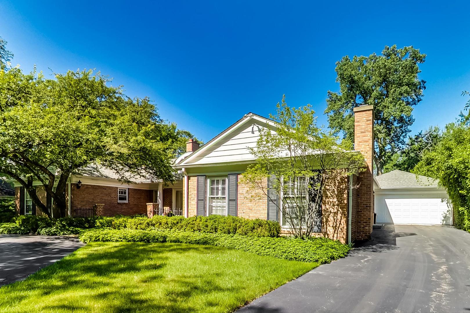 180 Westview Road Winnetka, IL 60093 - Photo 2 of 31 a front view of a house with a yard
