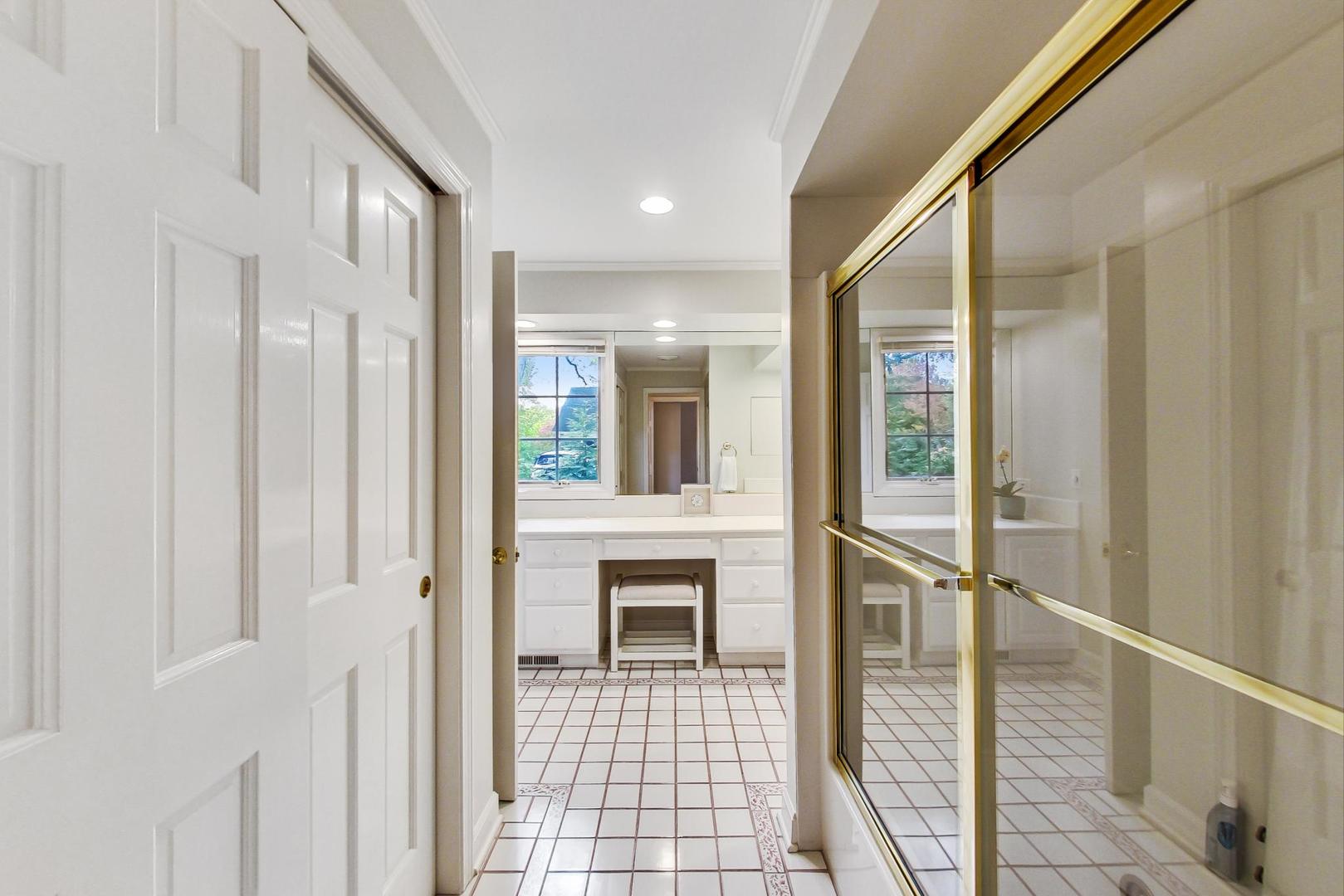 180 Westview Road Winnetka, IL 60093 - Photo 22 of 31 a view of a hallway with wooden floor and staircase