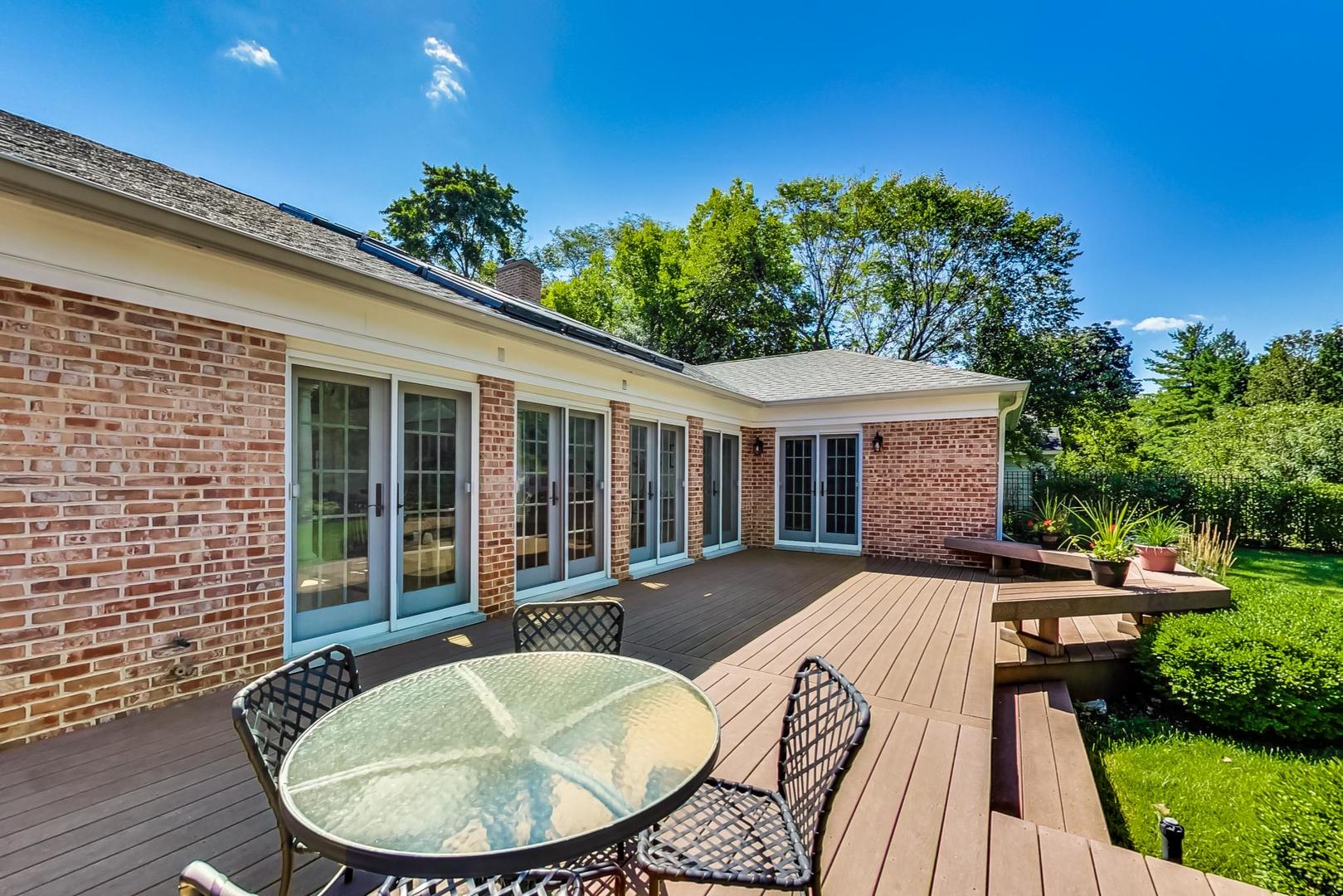180 Westview Road Winnetka, IL 60093 - Photo 24 of 31 a view of a house with backyard sitting area and backyard