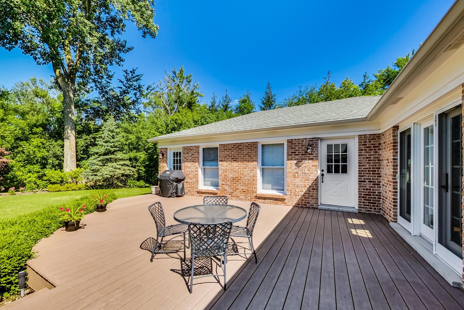 180 Westview Road Winnetka, IL 60093 - Photo 25 of 31 a view of a house with backyard sitting area and garden