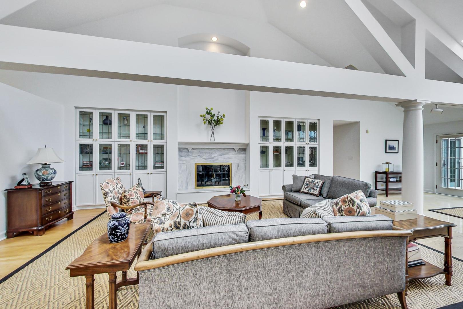 180 Westview Road Winnetka, IL 60093 - Photo 6 of 31 a living room with furniture large window and fireplace