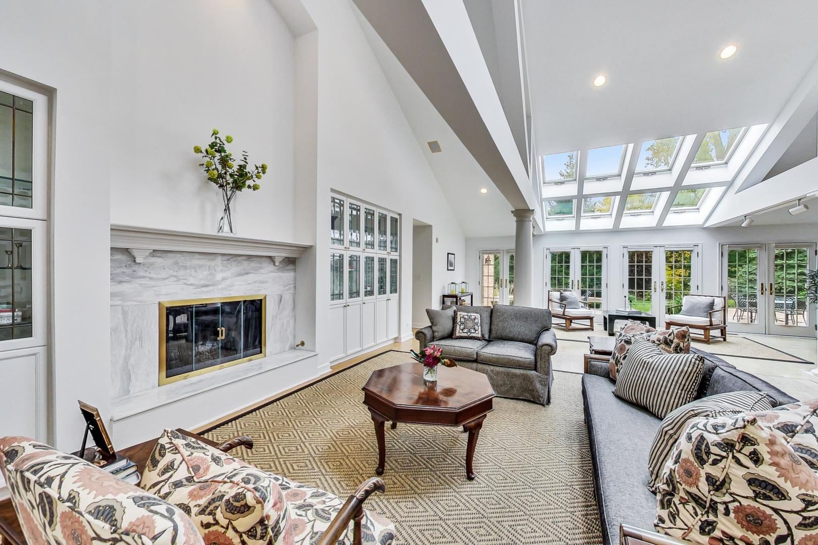 180 Westview Road Winnetka, IL 60093 - Photo 7 of 31 a living room with furniture and a fireplace
