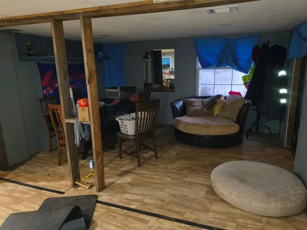 a living room filled with furniture and a rug