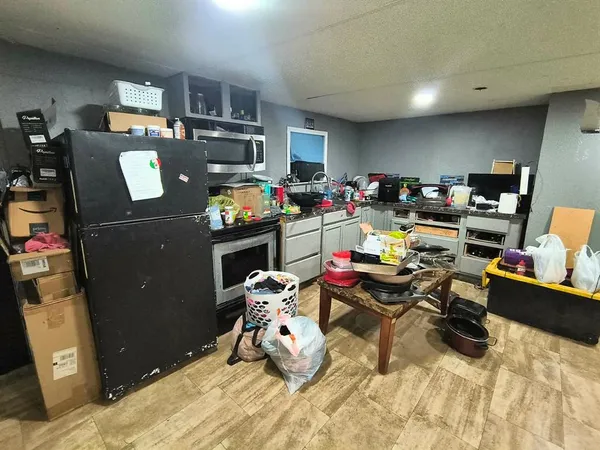 a bathroom with a sink and mirror with bathtub