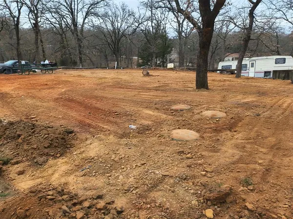 a view of yard covered with snow in front of house