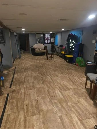 a lobby with furniture and gym equipment