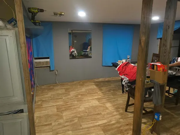 a workspace with furniture and a flat screen tv