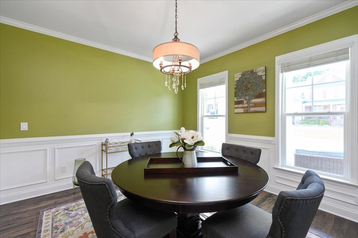 7032 Rex Road Holly Springs, NC 27540 - Photo 11 of 38 Lovely dining room with molding and upgraded lighting Dining Room