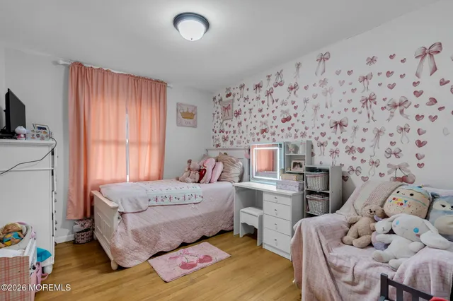 a bed room with a bed and a chair