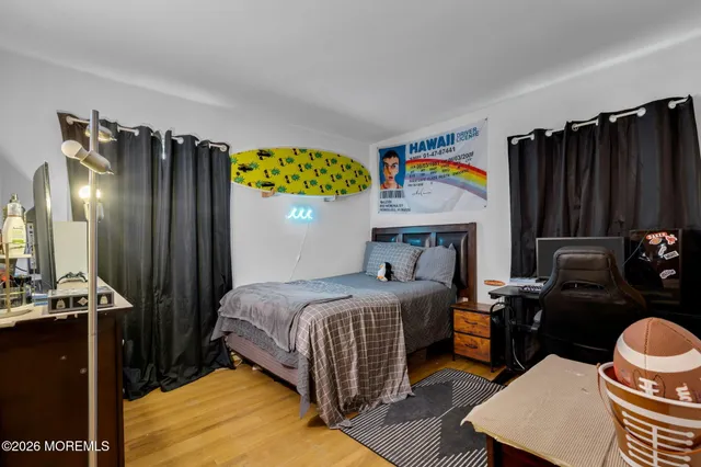 a bedroom with a bed and dresser