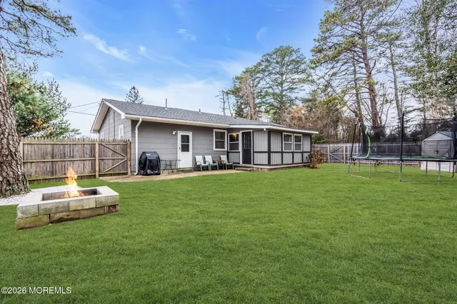 a front view of house with yard slide and outdoor seating