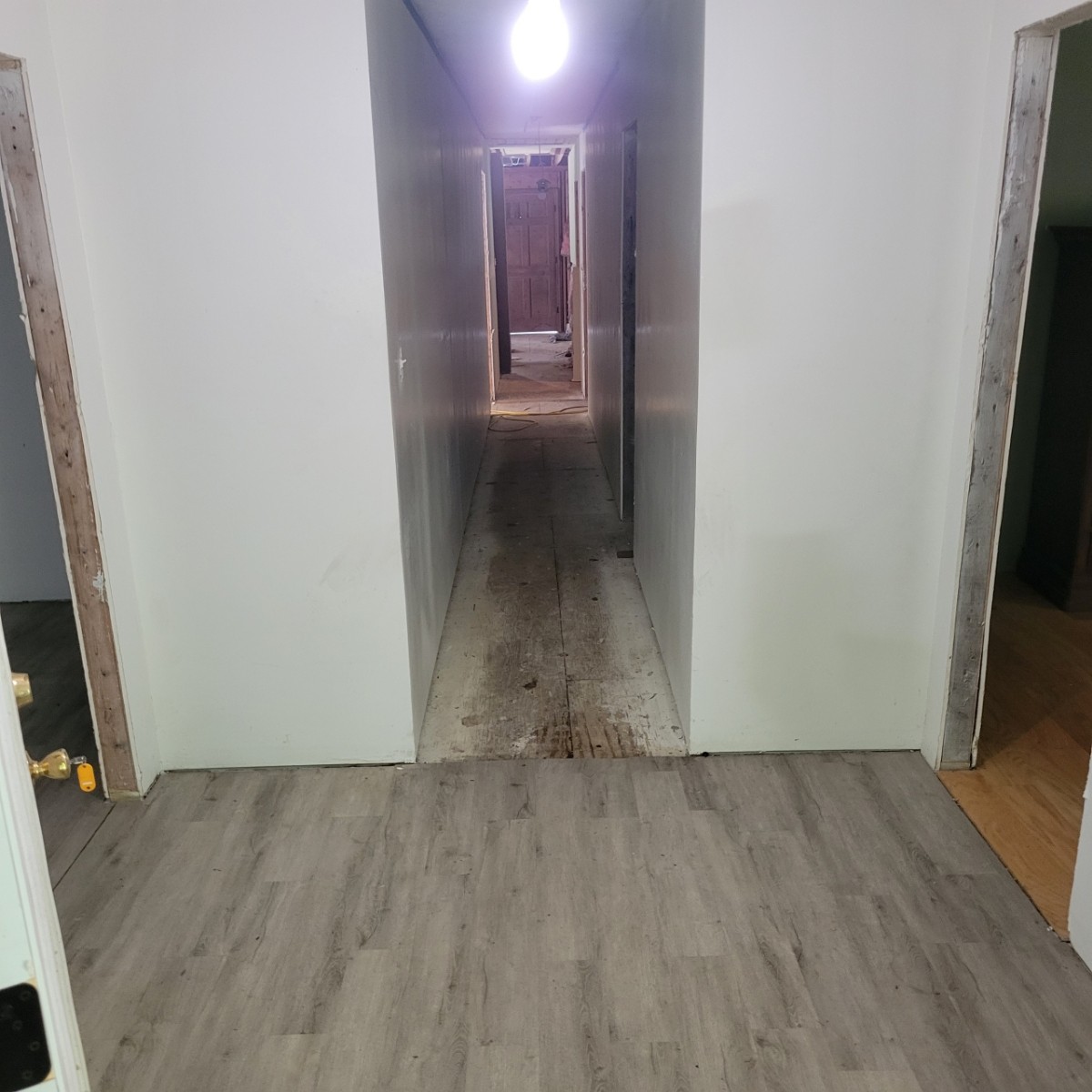 1376 Panhandle Road Manchester, TN 37355 - Photo 3 of 13 an empty room with wooden floor and windows