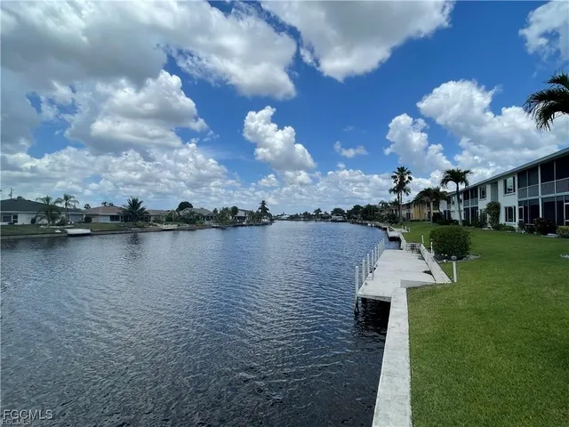 a view of a lake with a house in the background