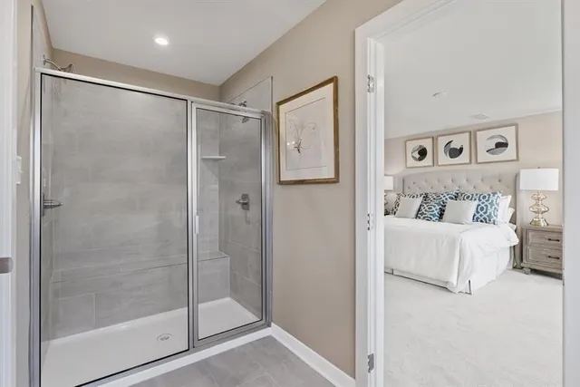 a bathroom with a glass shower door